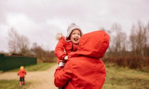 Family wearing red coats, for Valentine’s Day, give the gift of a will and an estate plan